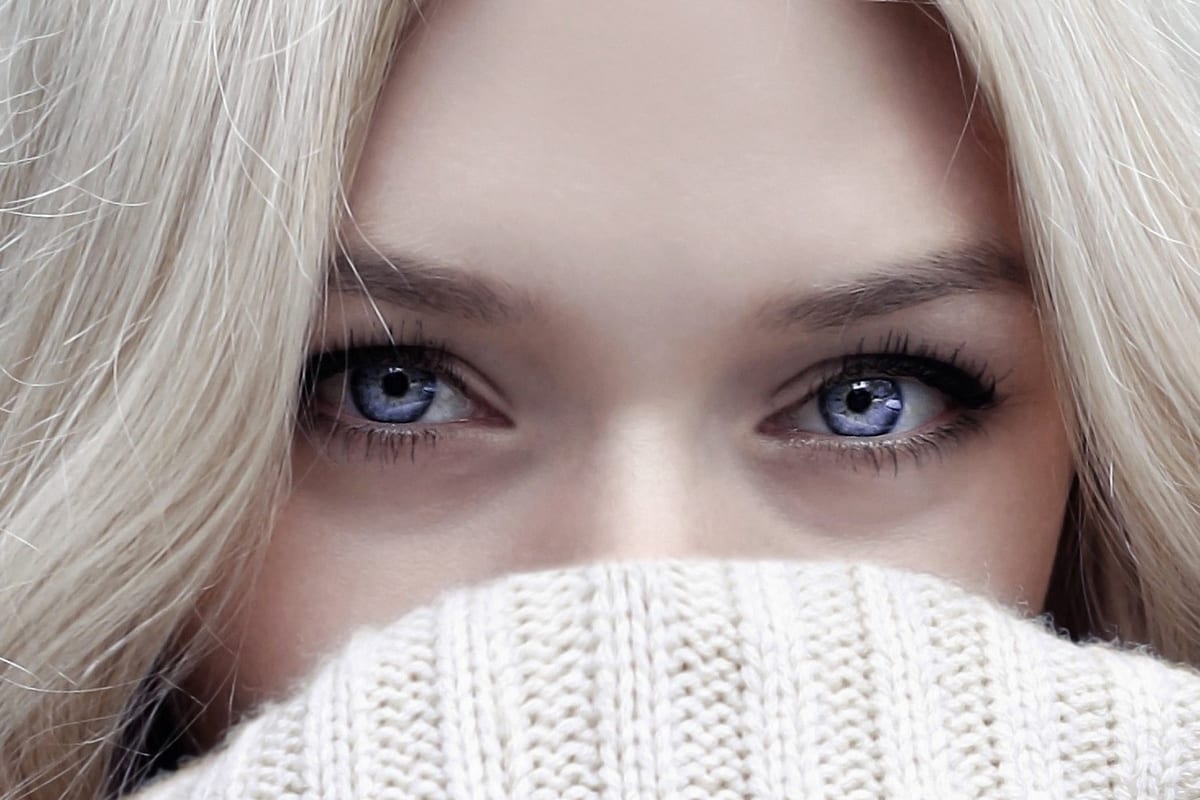 close up of a pale model with blue eyes before color correction