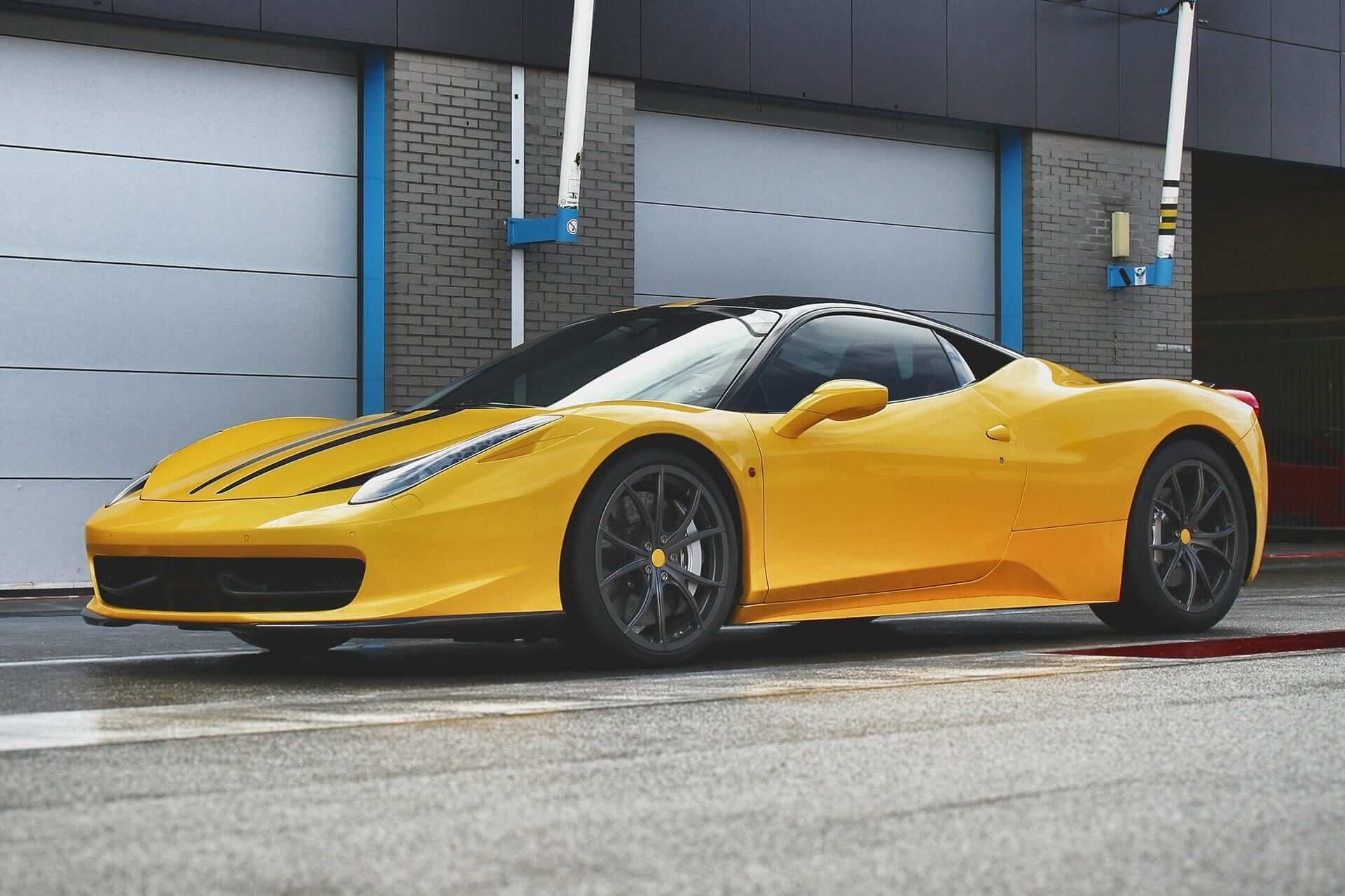 Yellow Ferrari in front of a garage before Color Correction